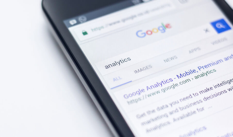 A phone showing a Google Analytics search result.