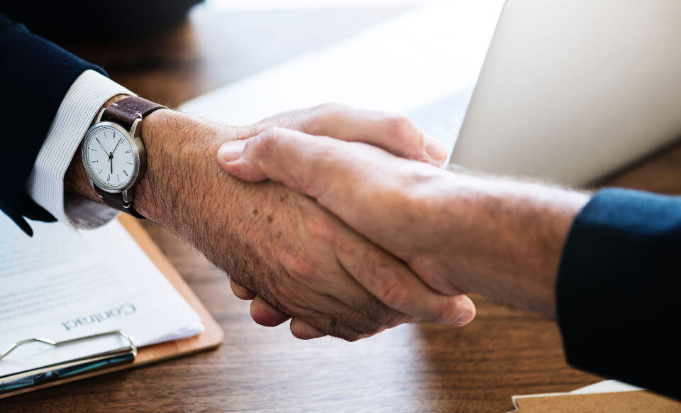 Two men shaking hands.