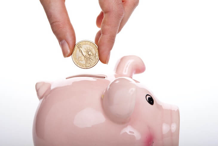Putting money in piggybank - Don't waste money on bad SEO